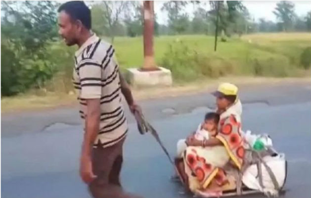 Pregnant Wife and Child on a cart, pulled by a Migrant Worker for 700km